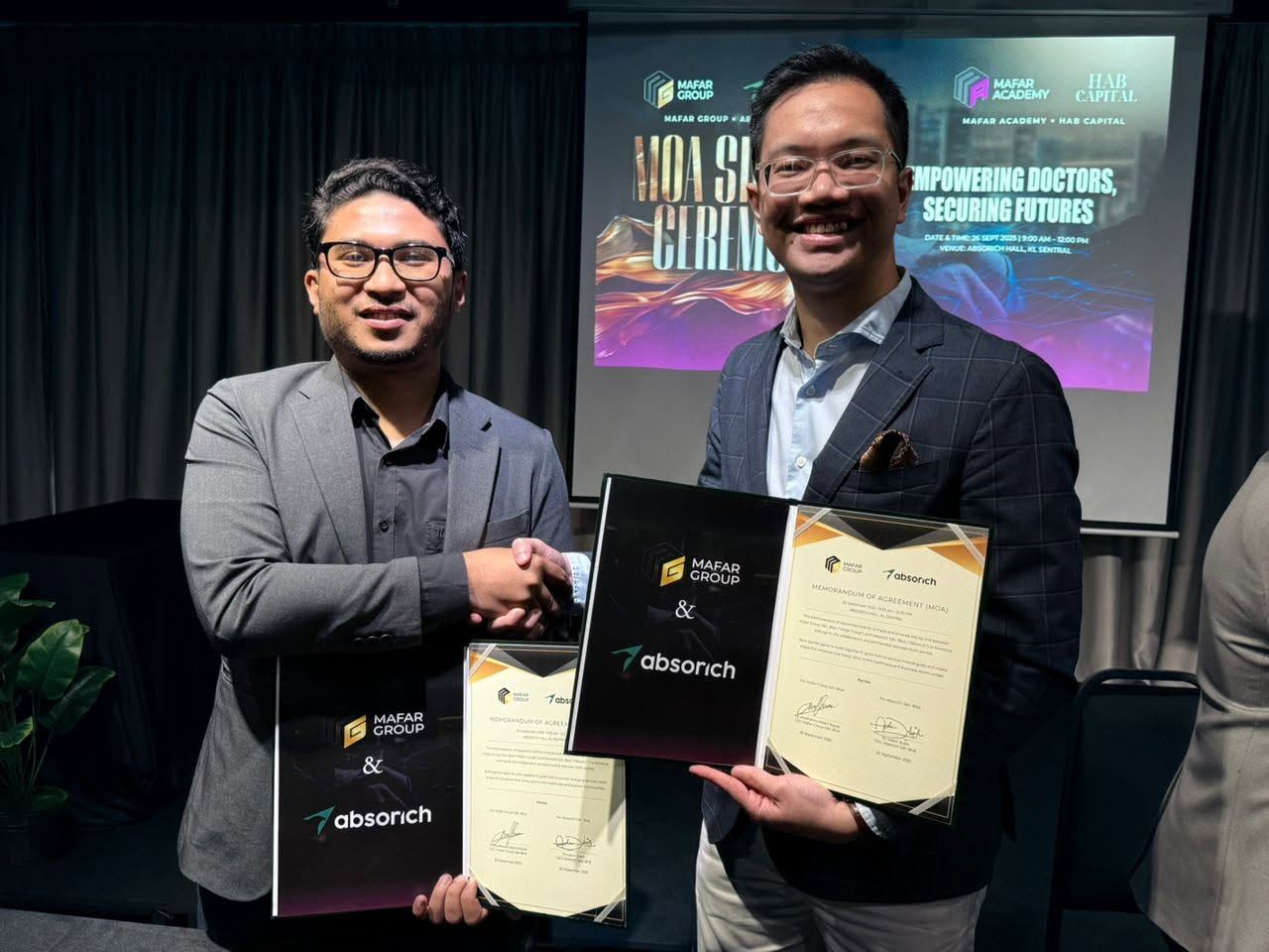 A partnership agreement exchanged on stage.