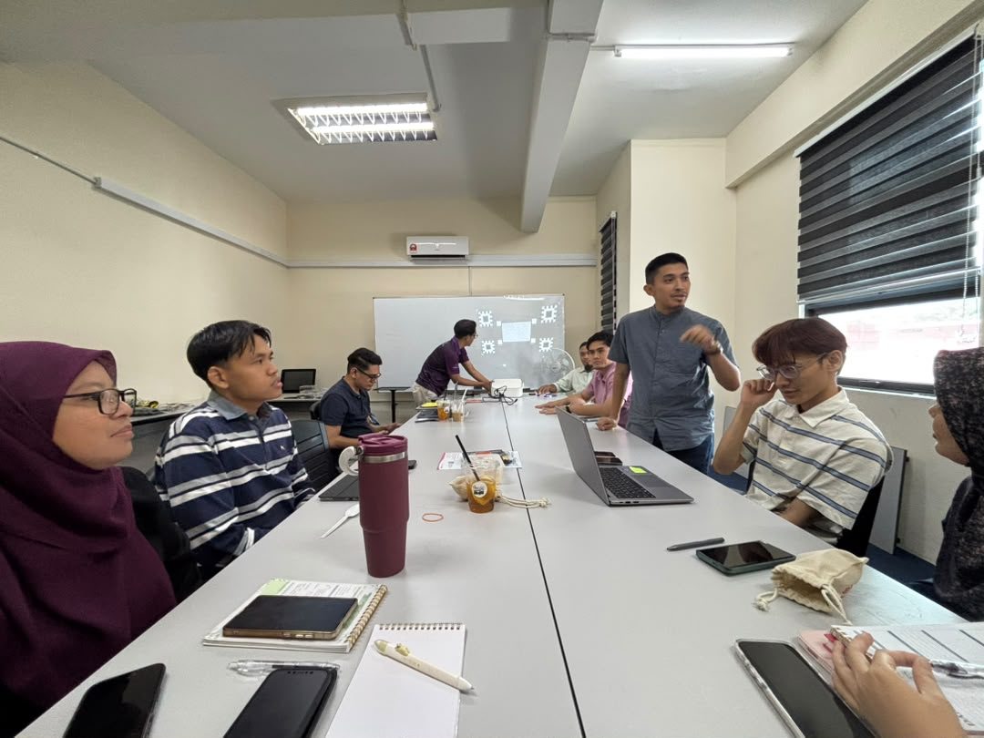 A working session with a clinic team around the table.